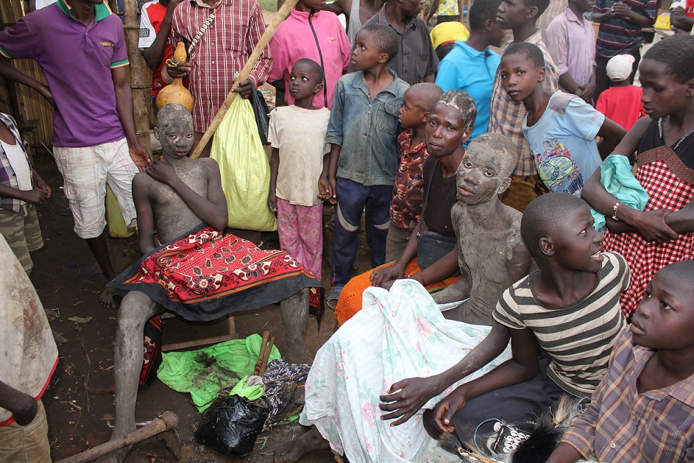 Gidudu on the right joined by his mum and Watuwa on the right after their circumcision