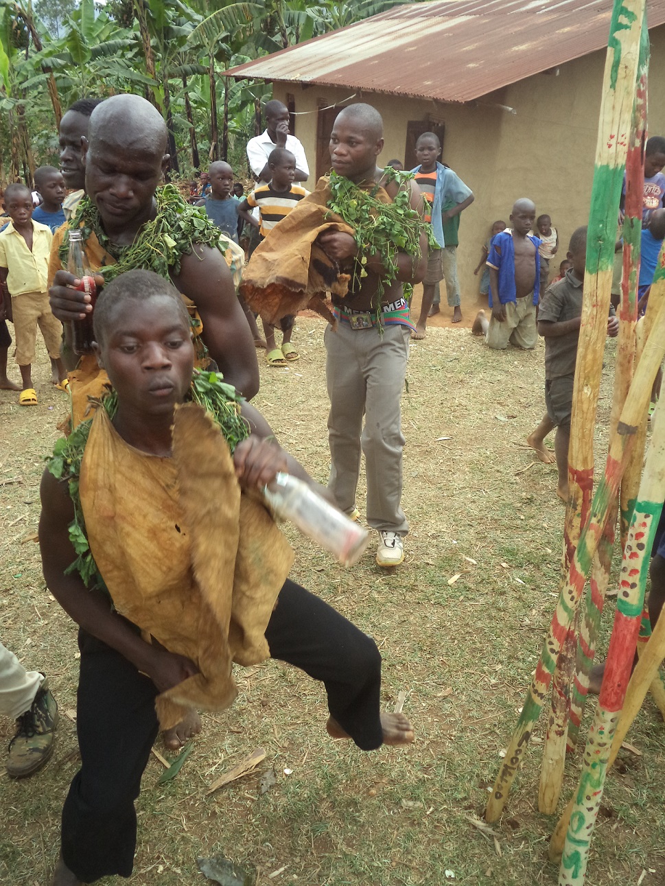 Initiates dancing their way into manhood.3