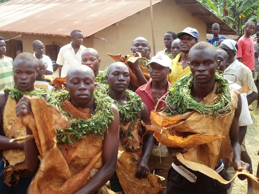 Initiates dancing their way into manhood.6