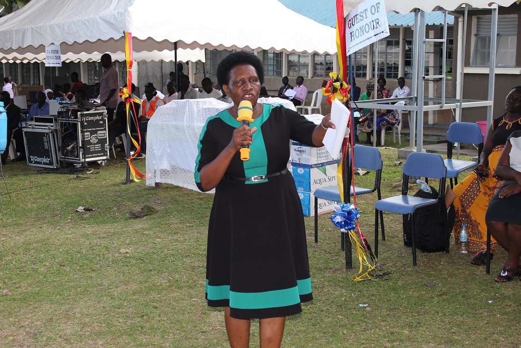 Mary Nteete the Principal Education Officer at the Education and Sports Ministry making a speech at the event