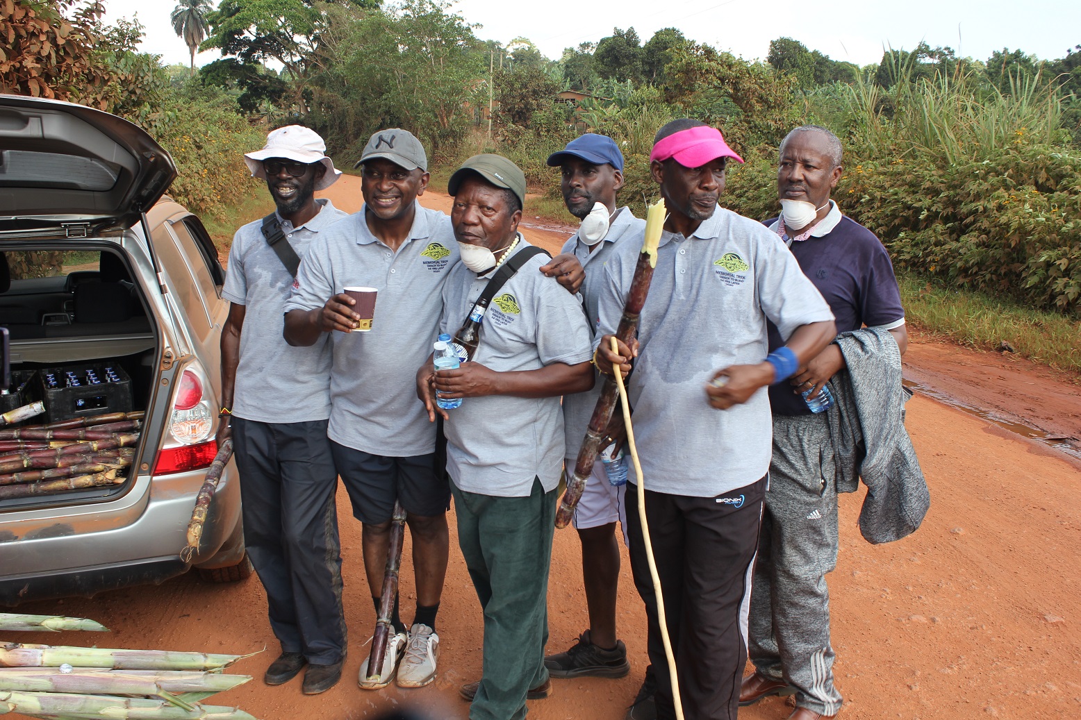 Some of the trekkers stop for a sugarcane break in Namugoga